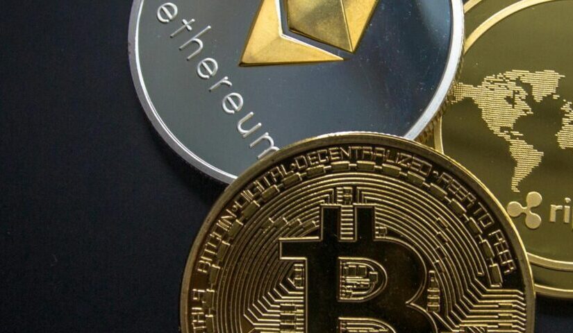 A striking image of Bitcoin, Ethereum, and Ripple coins illustrating modern digital currency.